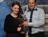 Hannah Gribbon presents Brendan McMullan with the Eugene Gribbon Trophy for Senior Hurler of the Year.